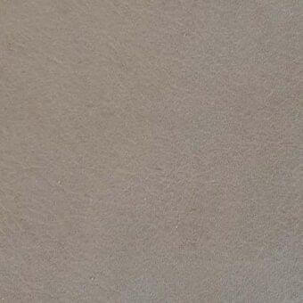 Rugiano rug, aniline cashmere leather, mottled fumo texture with granular appearance and subtle color variations across a dense, tactile surface.